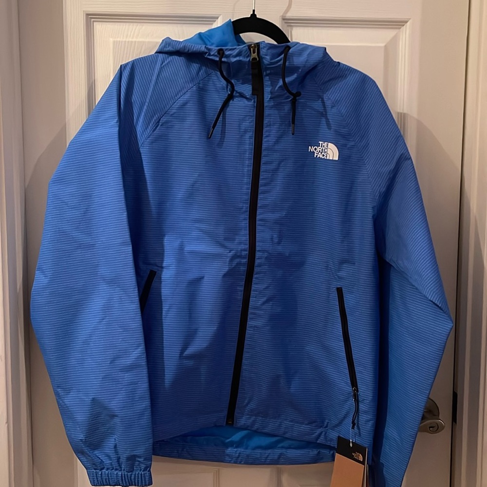 New with tags The North Face rain blue jacket. Size Small for Men’s.